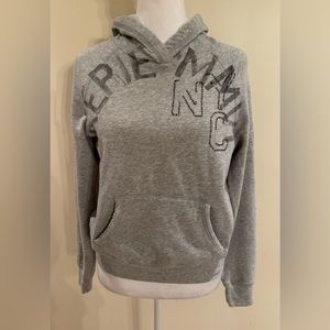 Arie grey hoodie sweatshirt with light grey/black lettering-. Size S